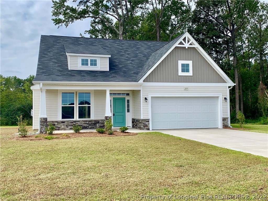 259 Mill Ridge Court Godwin, NC 28344 - Photo 1 of 19 a front view of a house with a yard