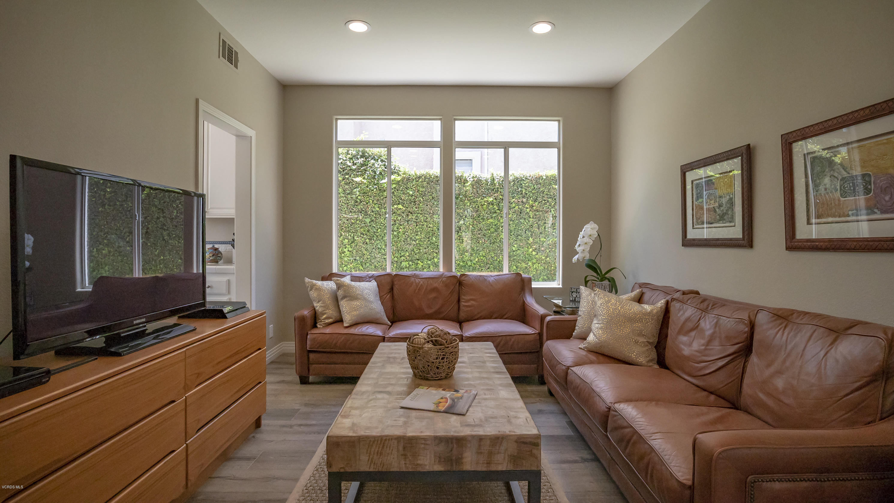 3944 Sunsetridge Road Moorpark, CA 93021 - Photo 5 of 25 a living room with furniture and a flat screen tv