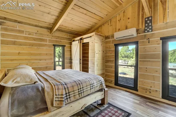 a view of walk in closet and bathroom