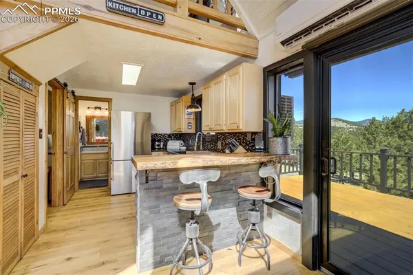 a kitchen with granite countertop a sink and cabinets