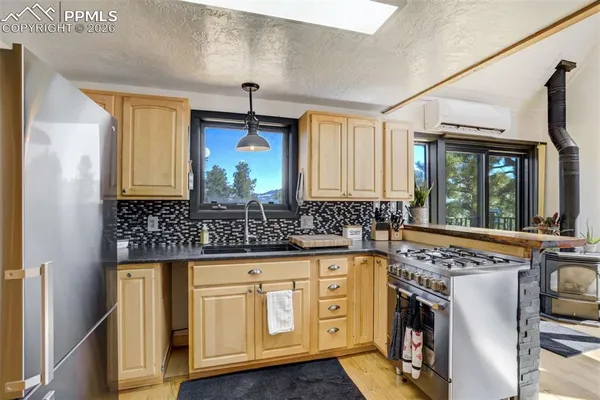 a kitchen that has a stove and a microwave