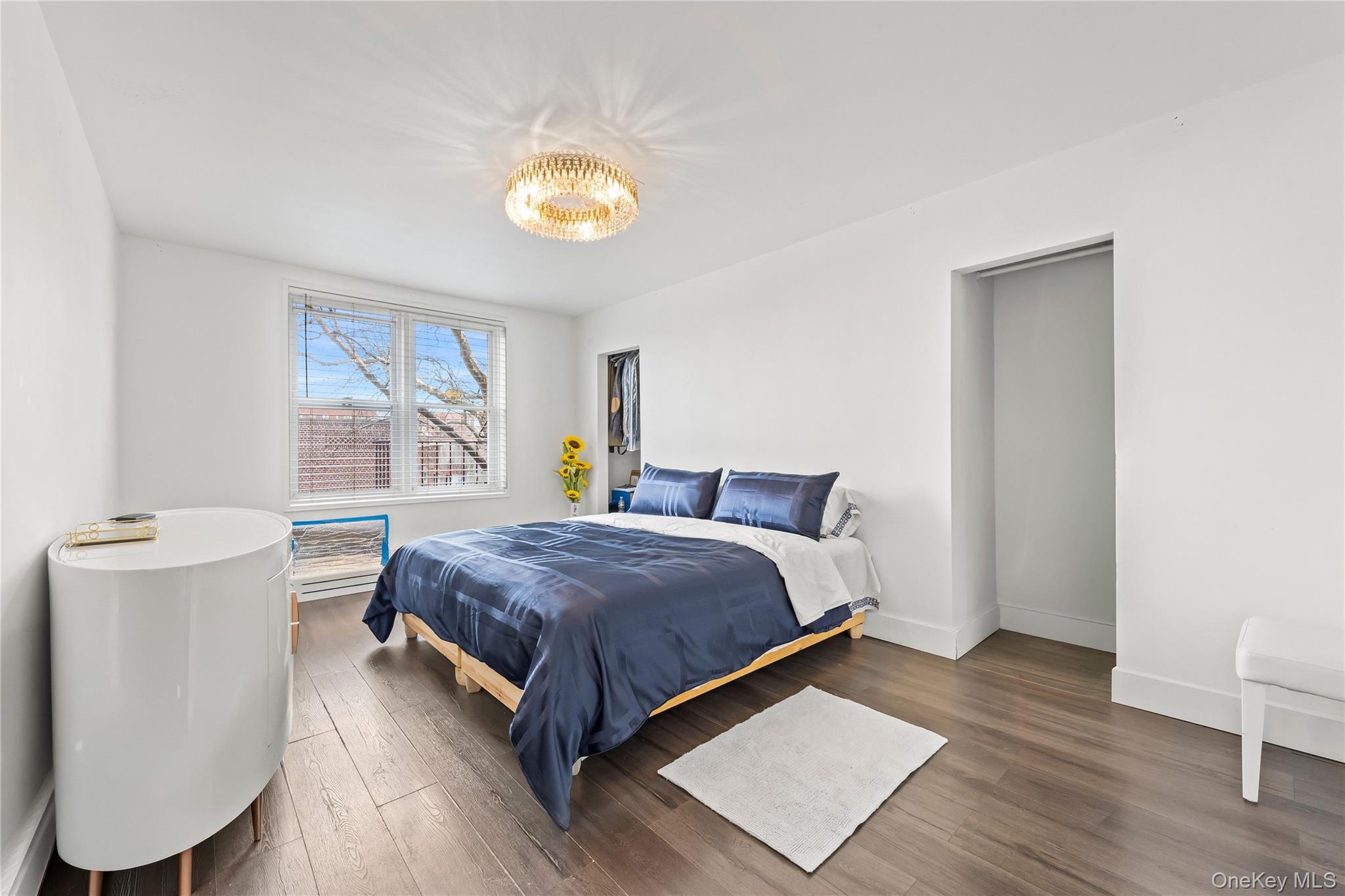 800 Cortelyou Road, Unit 3E Brooklyn, NY 11218 - Photo 5 of 13 a bedroom with a bed and a window