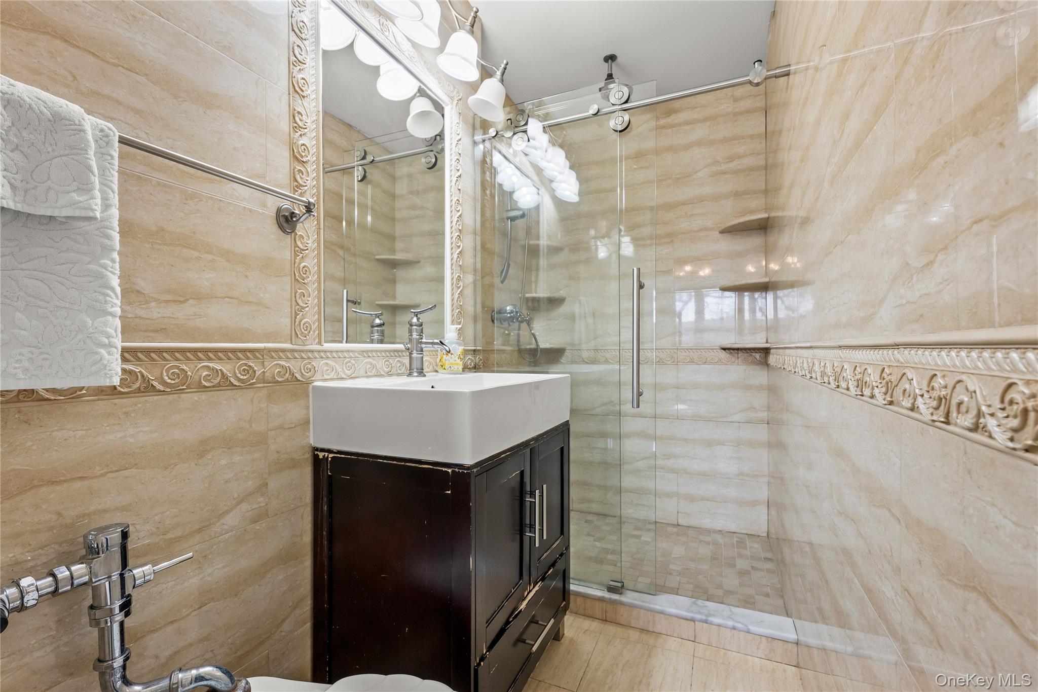 800 Cortelyou Road, Unit 3E Brooklyn, NY 11218 - Photo 6 of 13 a bathroom with a shower and a sink