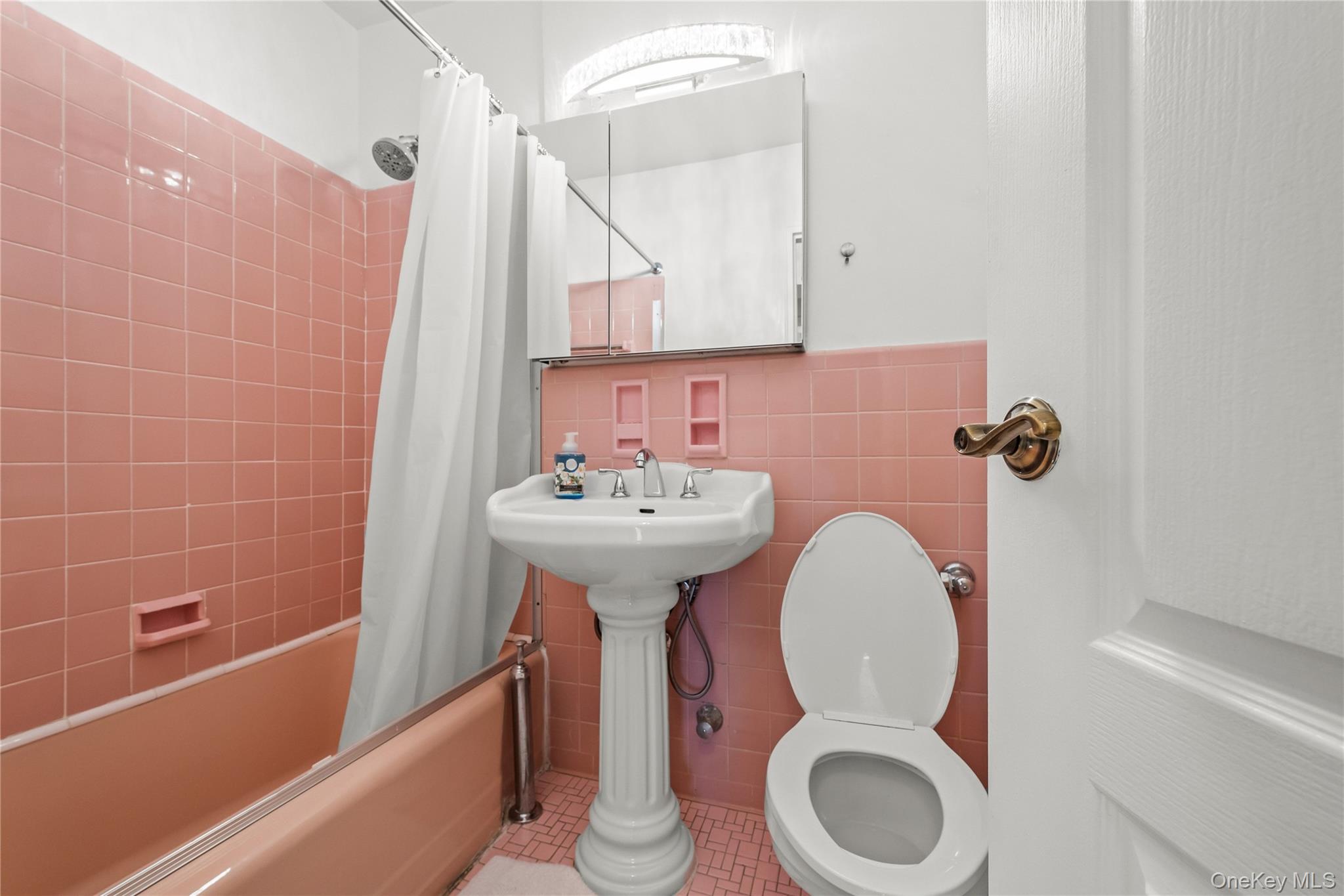 800 Cortelyou Road, Unit 3E Brooklyn, NY 11218 - Photo 8 of 13 a bathroom with a sink a toilet and bathtub