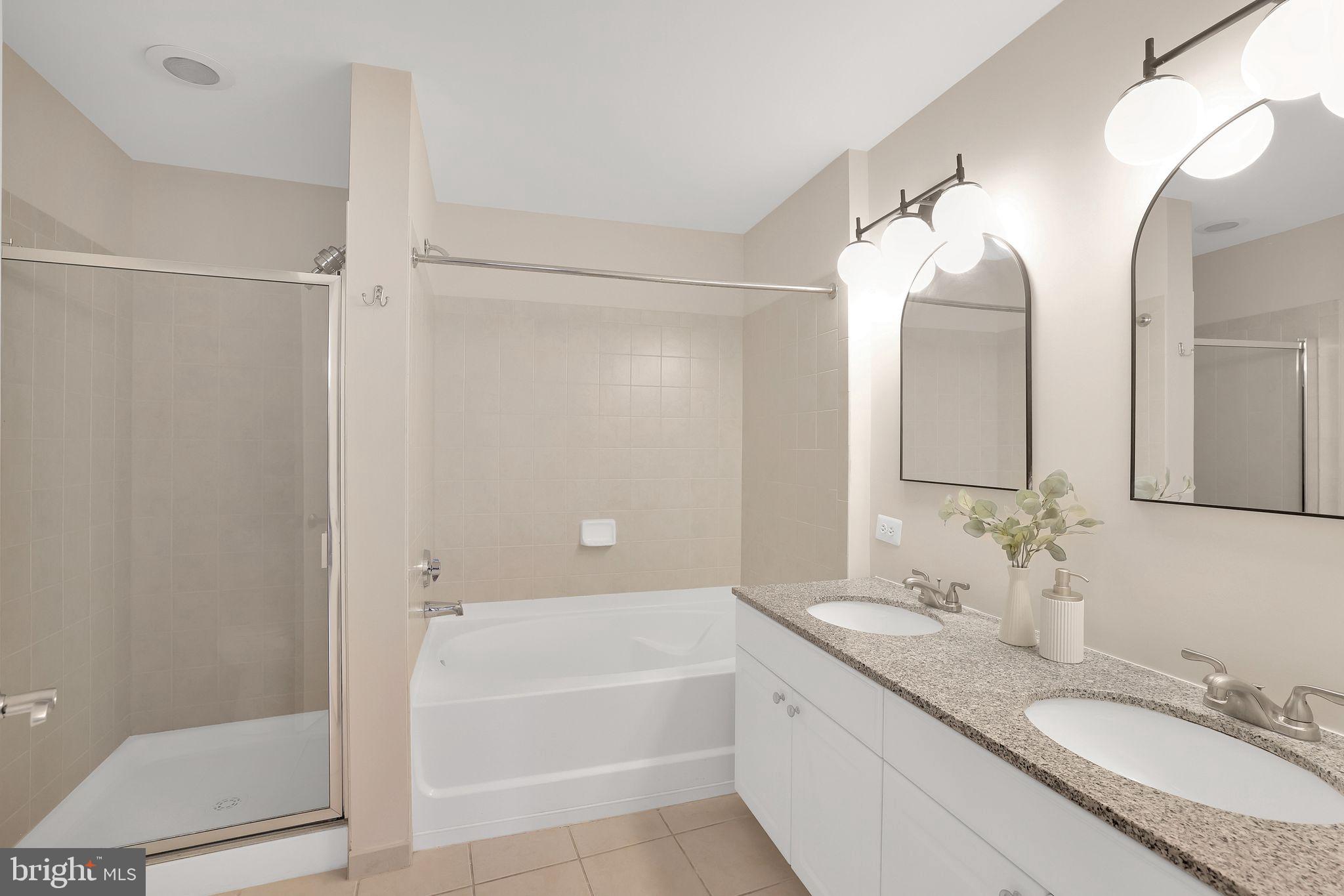 3600 South Glebe Road, Unit 321W Arlington, VA 22202 - Photo 25 of 51 Dual vanities, soaking tub, and stall shower