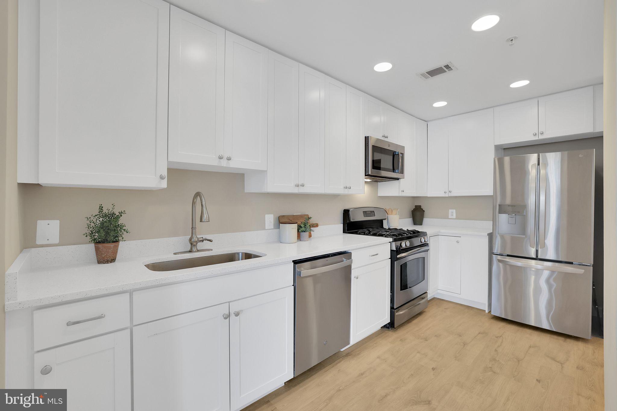 3600 South Glebe Road, Unit 321W Arlington, VA 22202 - Photo 3 of 51 New white cabinets with stainless appliances