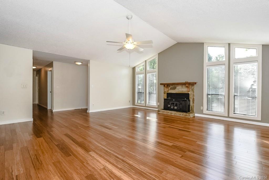 5064 Suwarrow Circle Tega Cay, SC 29708 - Photo 4 of 23 a view of an empty room with glass door and a window