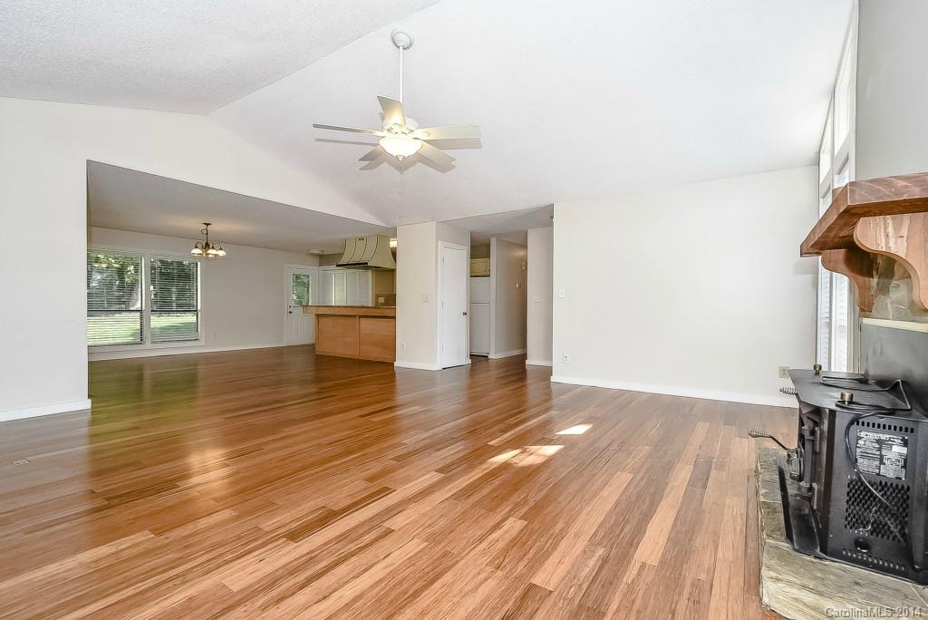5064 Suwarrow Circle Tega Cay, SC 29708 - Photo 5 of 23 a view of empty room with wooden floor and fan