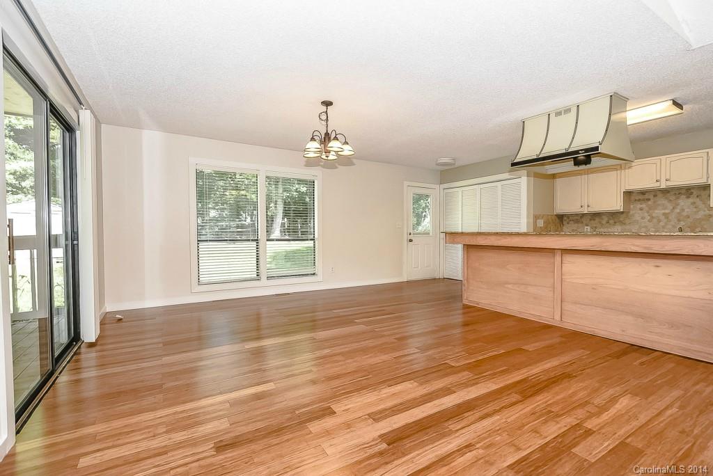 5064 Suwarrow Circle Tega Cay, SC 29708 - Photo 6 of 23 a view of a kitchen with wooden floor and a sink