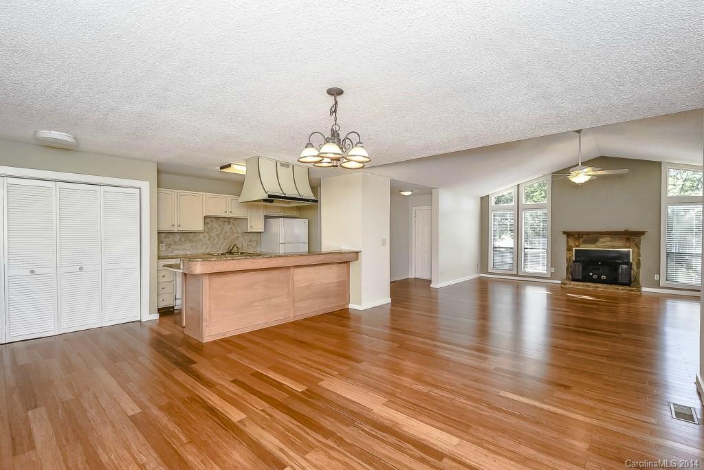 5064 Suwarrow Circle Tega Cay, SC 29708 - Photo 7 of 23 a view of a kitchen with a sink and a fireplace