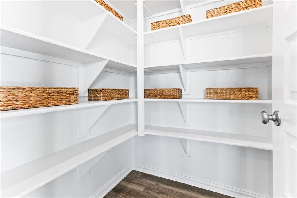 2339 Butler Avenue Fate, TX 75087 - Photo 12 of 35 a view of walk in closet with empty racks