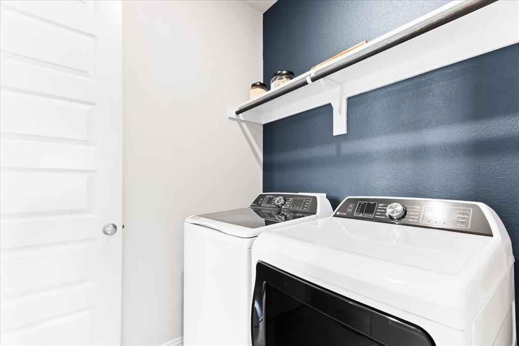 2339 Butler Avenue Fate, TX 75087 - Photo 19 of 35 a utility room with dryer and washer