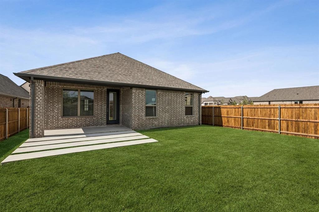 2339 Butler Avenue Fate, TX 75087 - Photo 23 of 35 a view of a house with backyard and garden