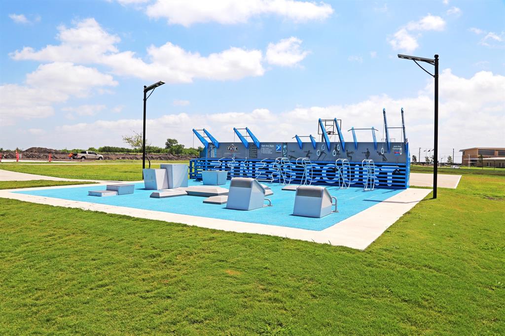 2339 Butler Avenue Fate, TX 75087 - Photo 32 of 35 a view of a swimming pool with a yard