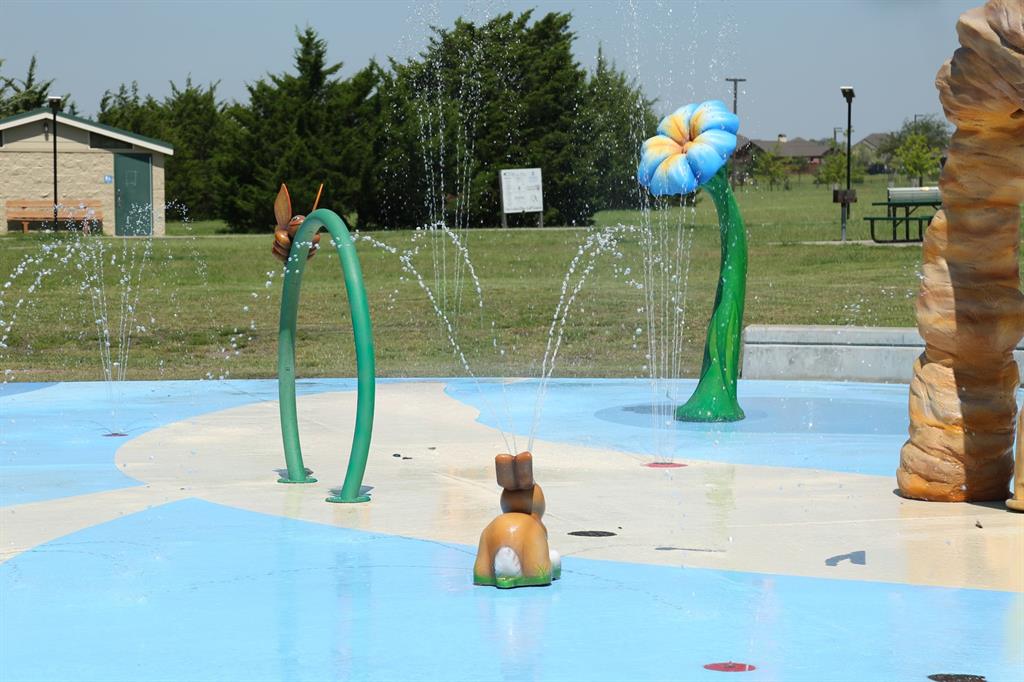 2339 Butler Avenue Fate, TX 75087 - Photo 34 of 35 a front view of a house with a garden