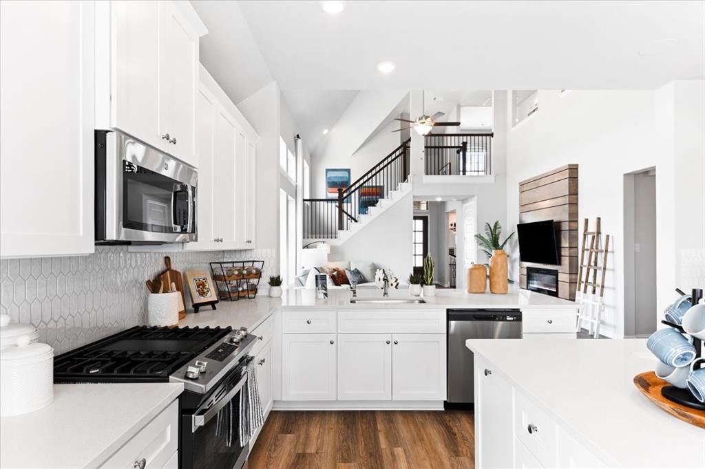 2339 Butler Avenue Fate, TX 75087 - Photo 10 of 35 a kitchen with a sink stove and microwave