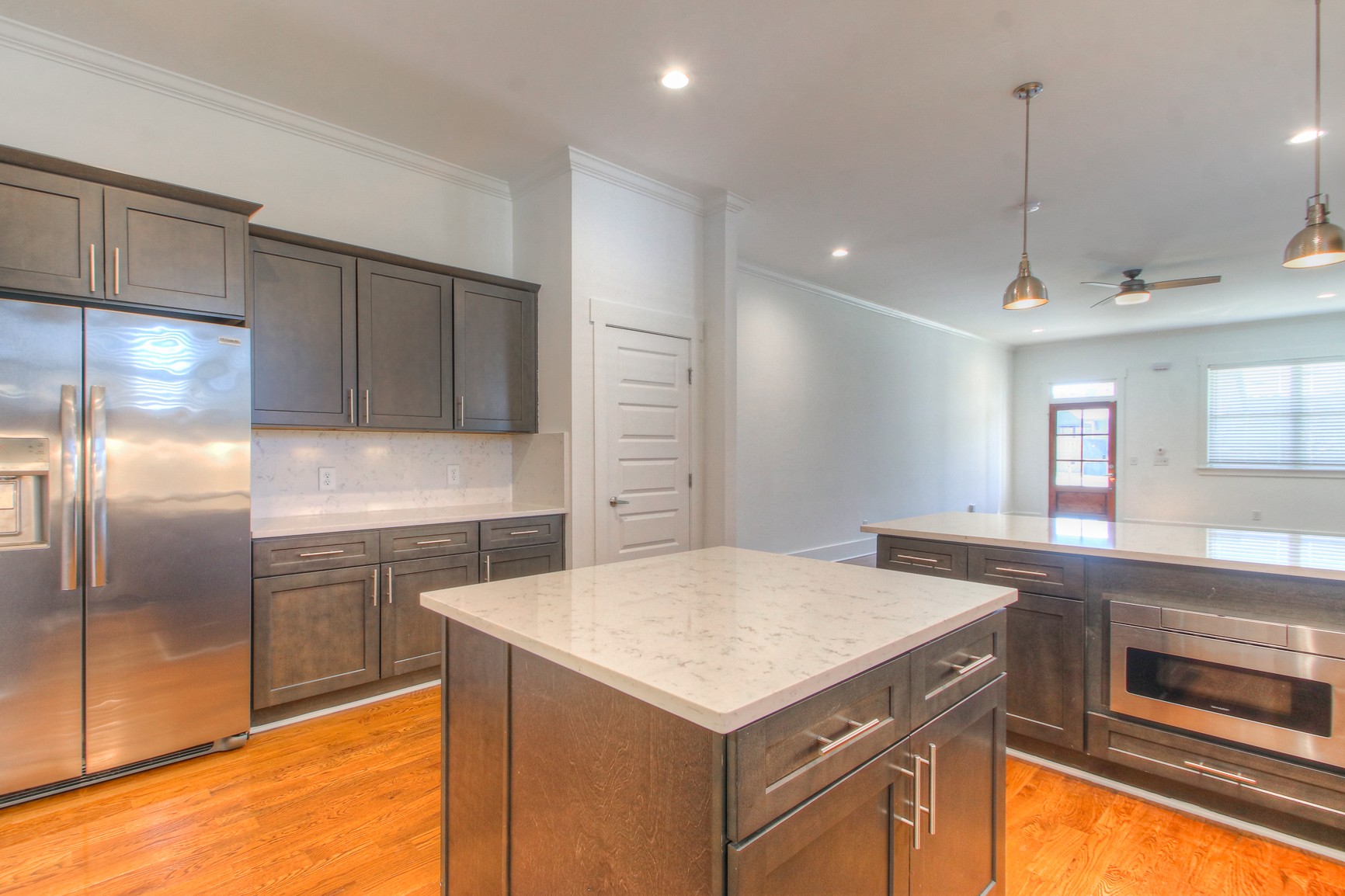 341 Edwin Street, Unit A Nashville, TN 37207 - Photo 11 of 37 a kitchen with a refrigerator a sink and cabinets