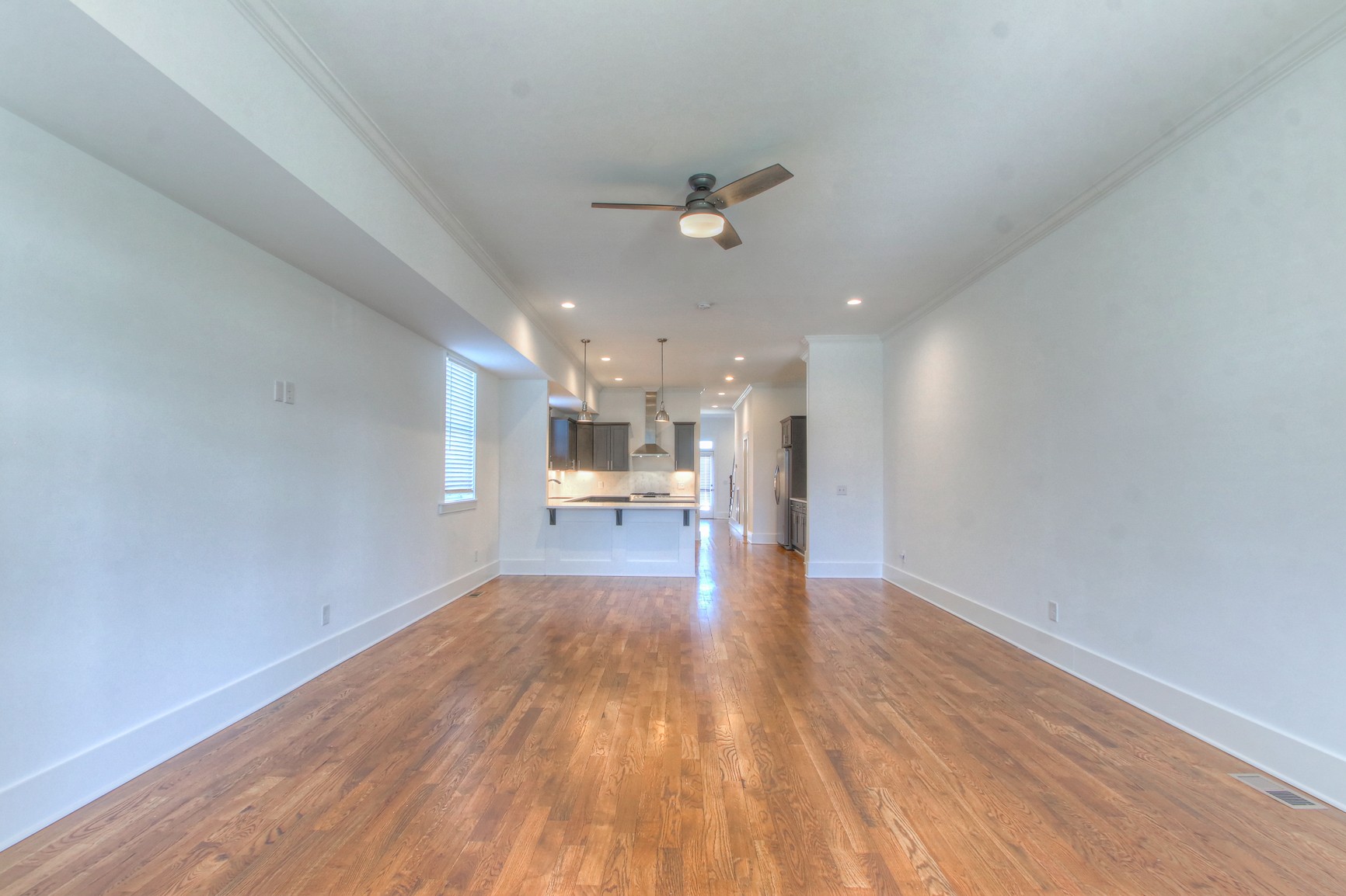 341 Edwin Street, Unit A Nashville, TN 37207 - Photo 4 of 37 a view of empty room with wooden floor