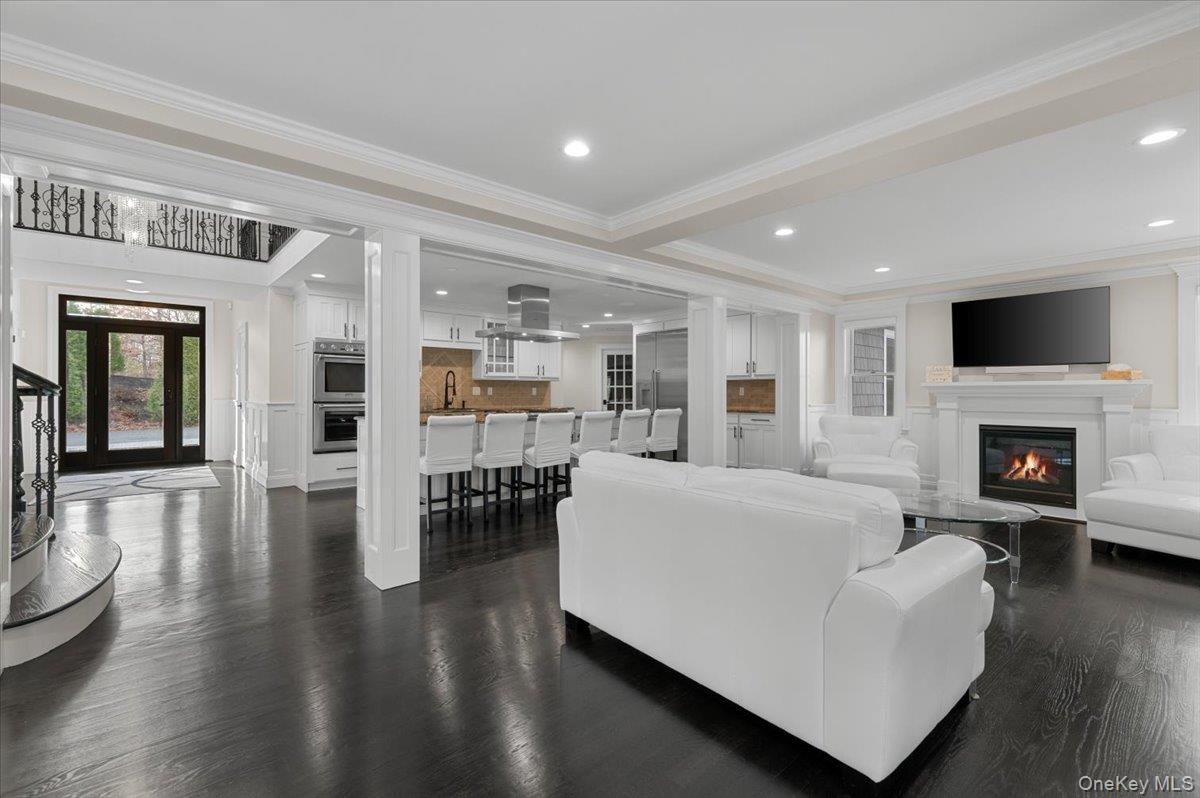 19 West Tiana Road Hampton Bays, NY 11946 - Photo 12 of 50 a living room with furniture wooden floor and a fireplace