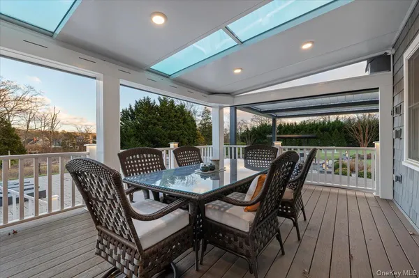 a view of a patio with a table and chairs