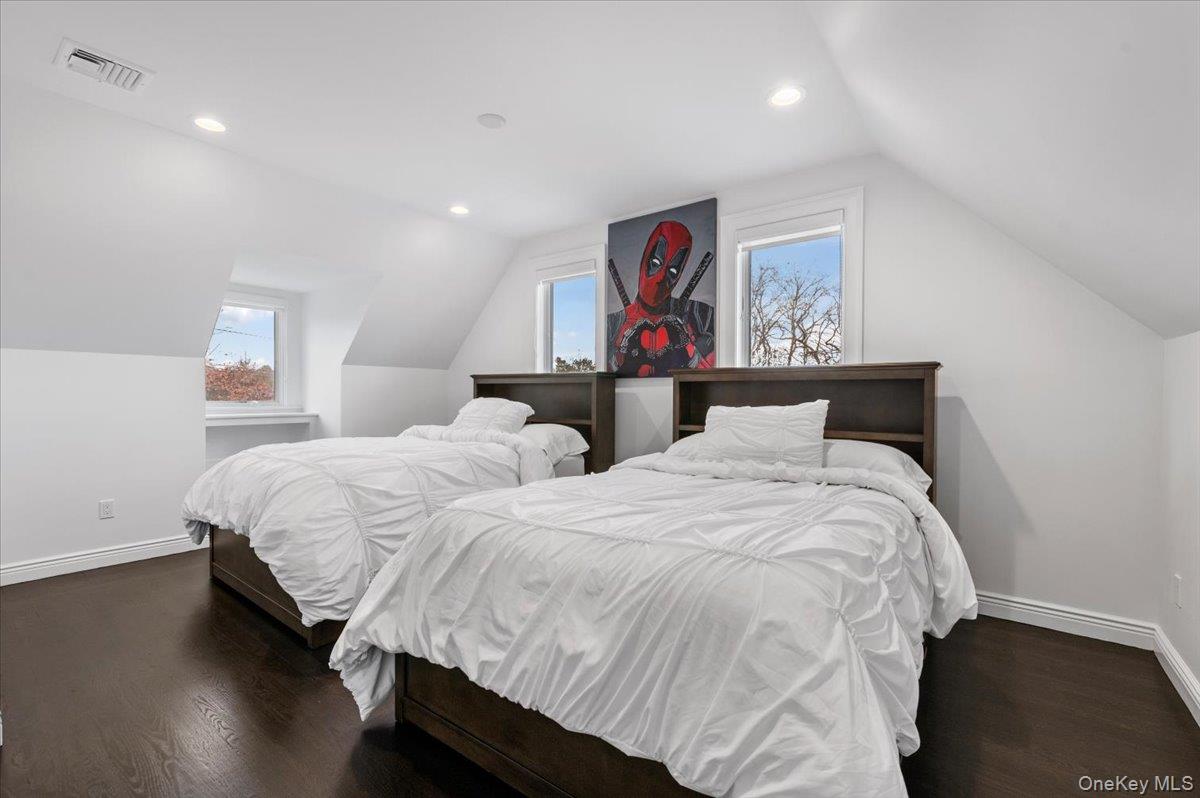 19 West Tiana Road Hampton Bays, NY 11946 - Photo 43 of 50 a bedroom with two beds and painting on the wall