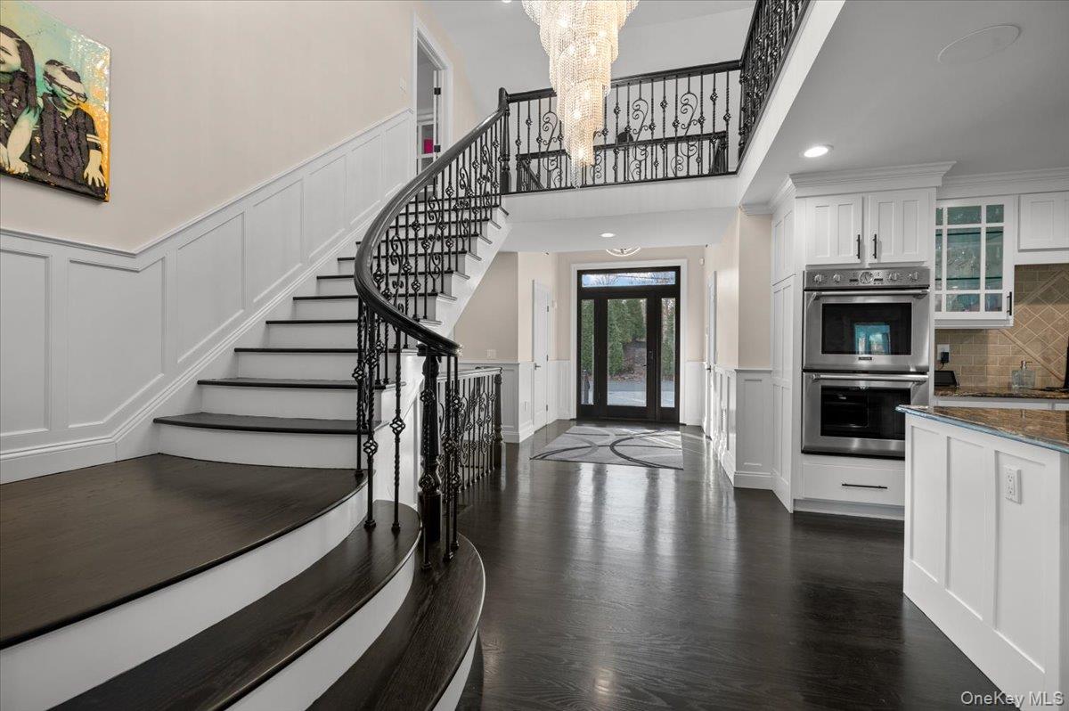 19 West Tiana Road Hampton Bays, NY 11946 - Photo 6 of 50 a view of entryway and hall with wooden floor