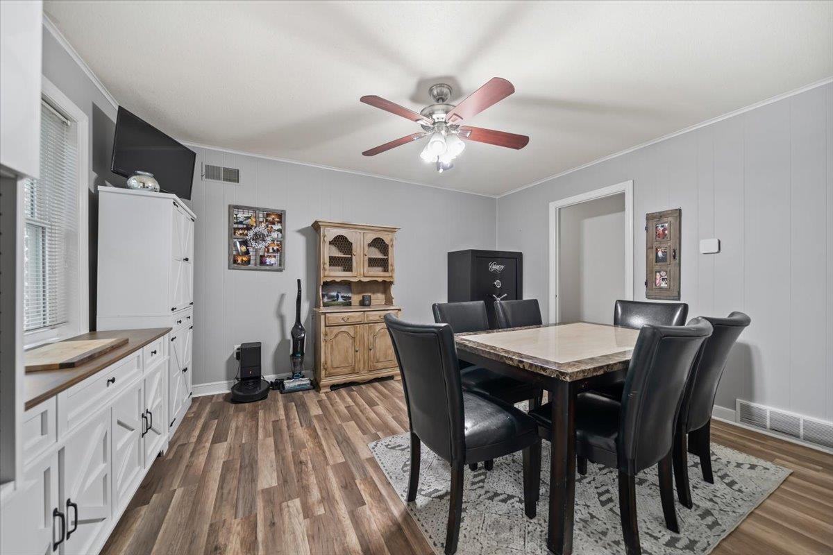 6315 Bardstown Road Bartlett, TN 38134 - Photo 16 of 31 Dining space featuring crown molding, dark wood finished floors, and ceiling fan