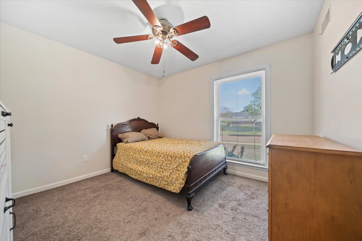 6315 Bardstown Road Bartlett, TN 38134 - Photo 20 of 31 Carpeted bedroom featuring ceiling fan and baseboards