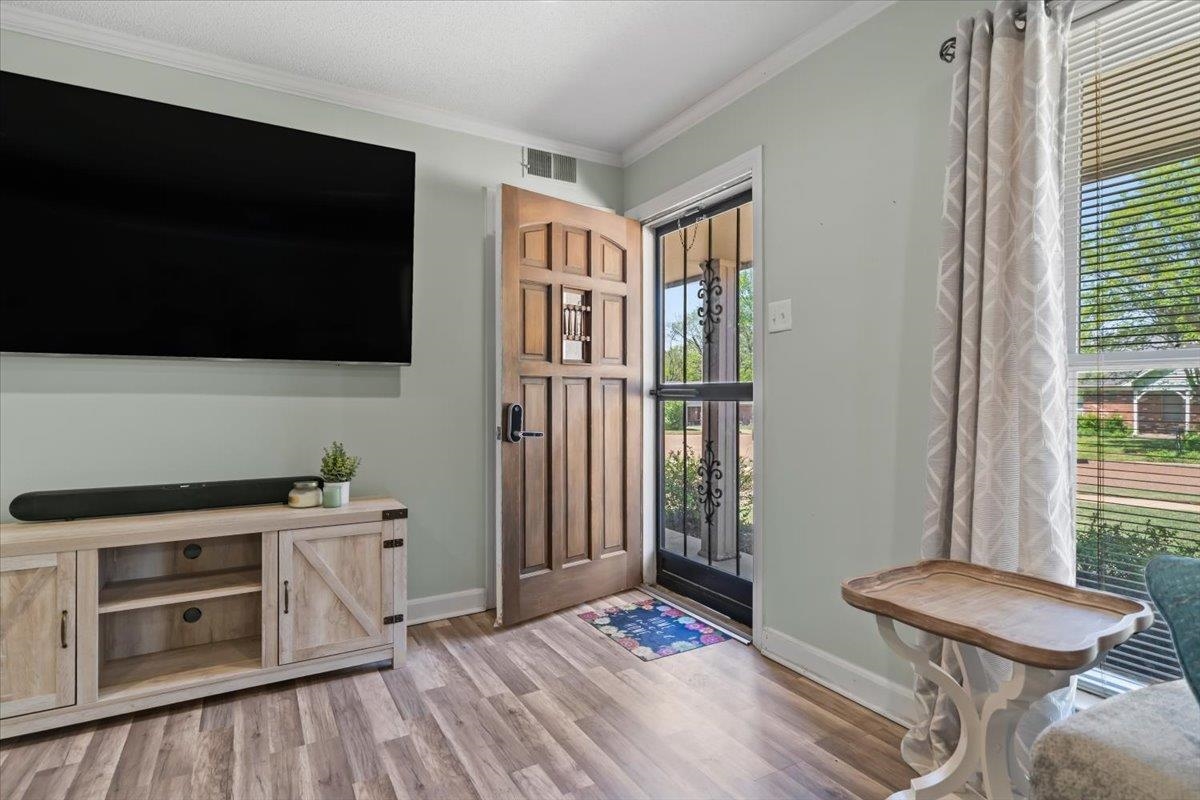 6315 Bardstown Road Bartlett, TN 38134 - Photo 6 of 31 Entrance foyer with crown molding and light wood-style floors