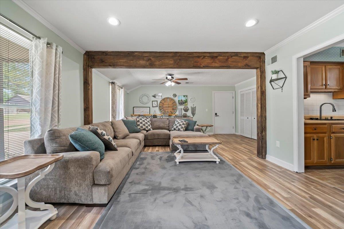 6315 Bardstown Road Bartlett, TN 38134 - Photo 8 of 31 Living room featuring ornamental molding, ceiling fan, light wood-style flooring, recessed lighting, and lofted ceiling