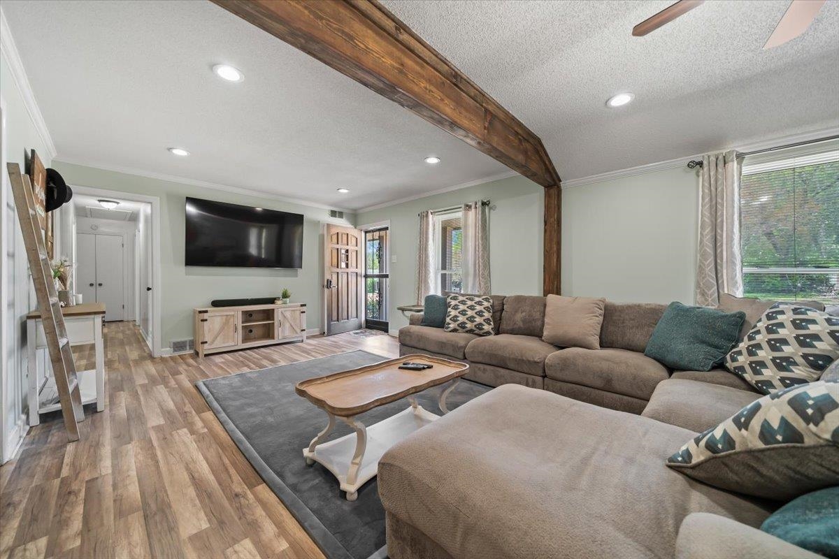6315 Bardstown Road Bartlett, TN 38134 - Photo 10 of 31 Living area with crown molding, beam ceiling, wood finished floors, ceiling fan, and recessed lighting