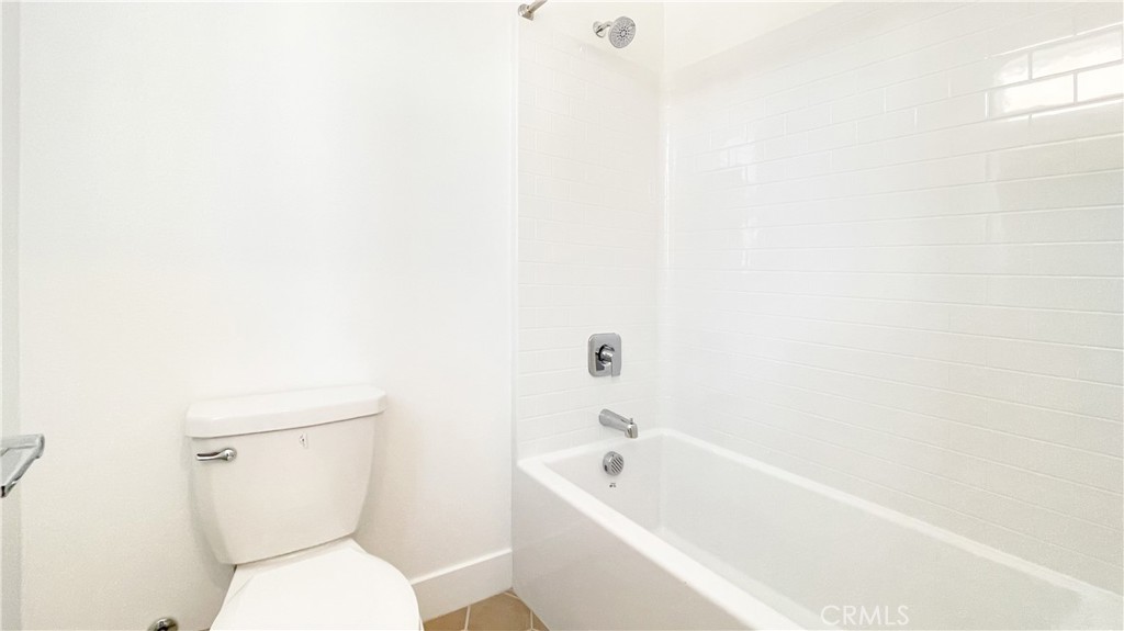 191 Junco Irvine, CA 92618 - Photo 28 of 31 a white toilet sitting next to a white bath tub