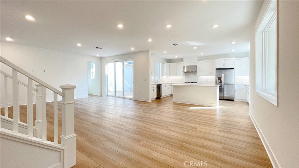 191 Junco Irvine, CA 92618 - Photo 5 of 31 a view of kitchen with wooden floor and electronic appliances