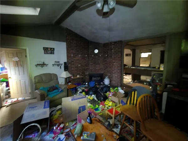 a living room filled with furniture and a fireplace
