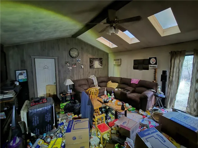 a living room with lots of furniture and a flat screen tv