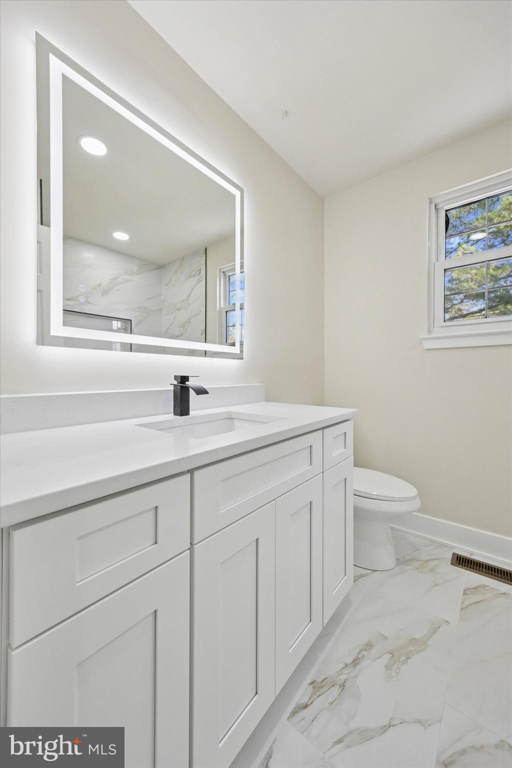 9 Nottingham Road Marlton, NJ 08053 - Photo 23 of 35 a bathroom with a toilet sink and mirror