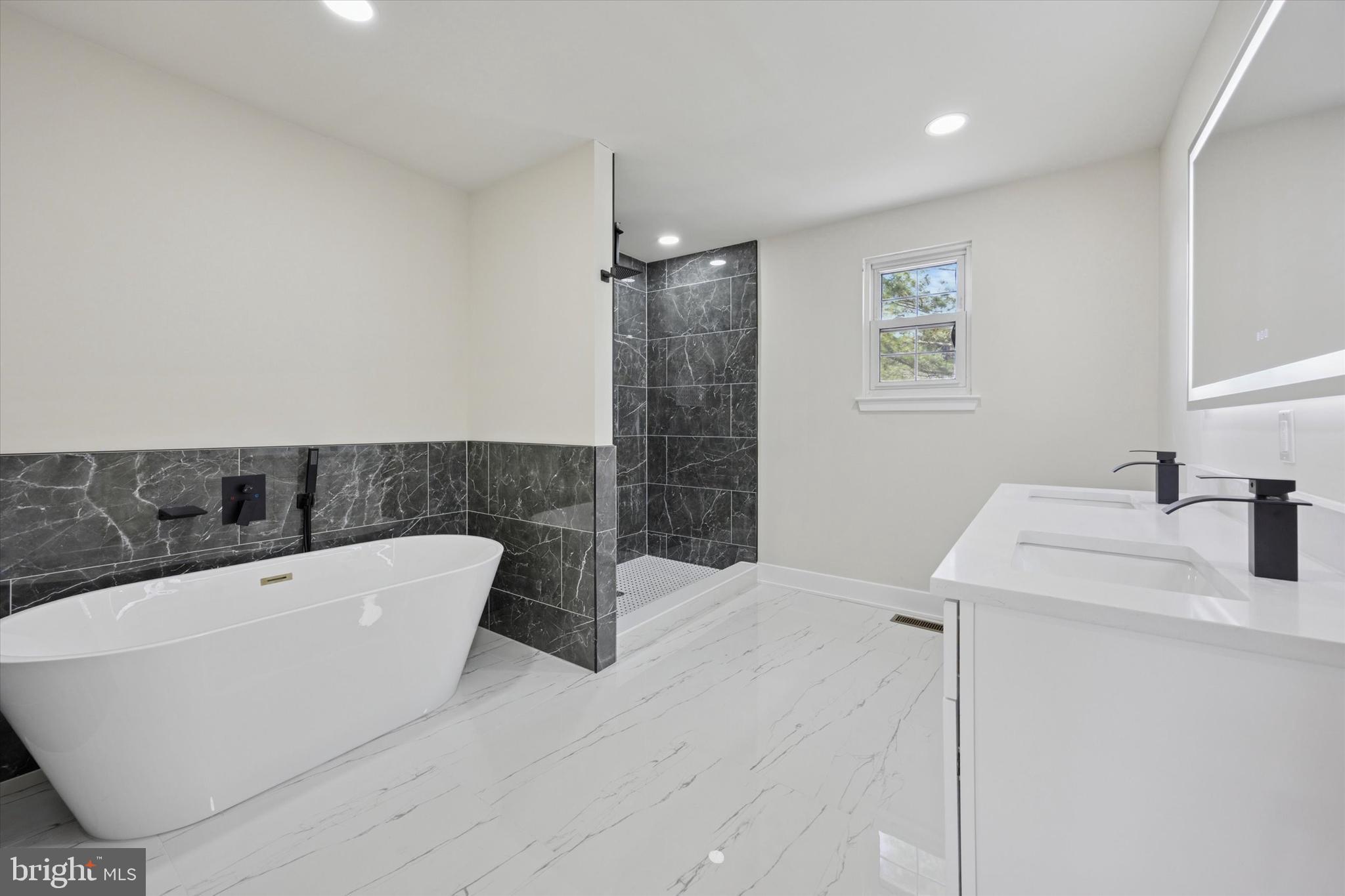 9 Nottingham Road Marlton, NJ 08053 - Photo 30 of 35 a bathroom with a bathtub and sink