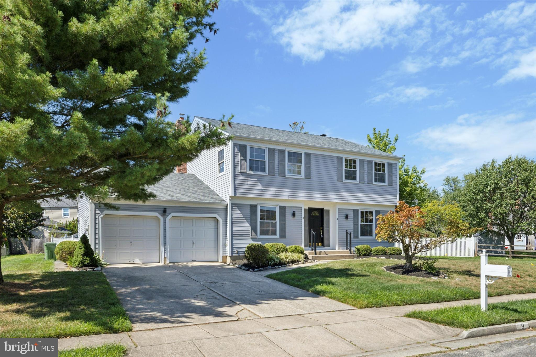 9 Nottingham Road Marlton, NJ 08053 - Photo 3 of 35 a front view of a house with garden and trees
