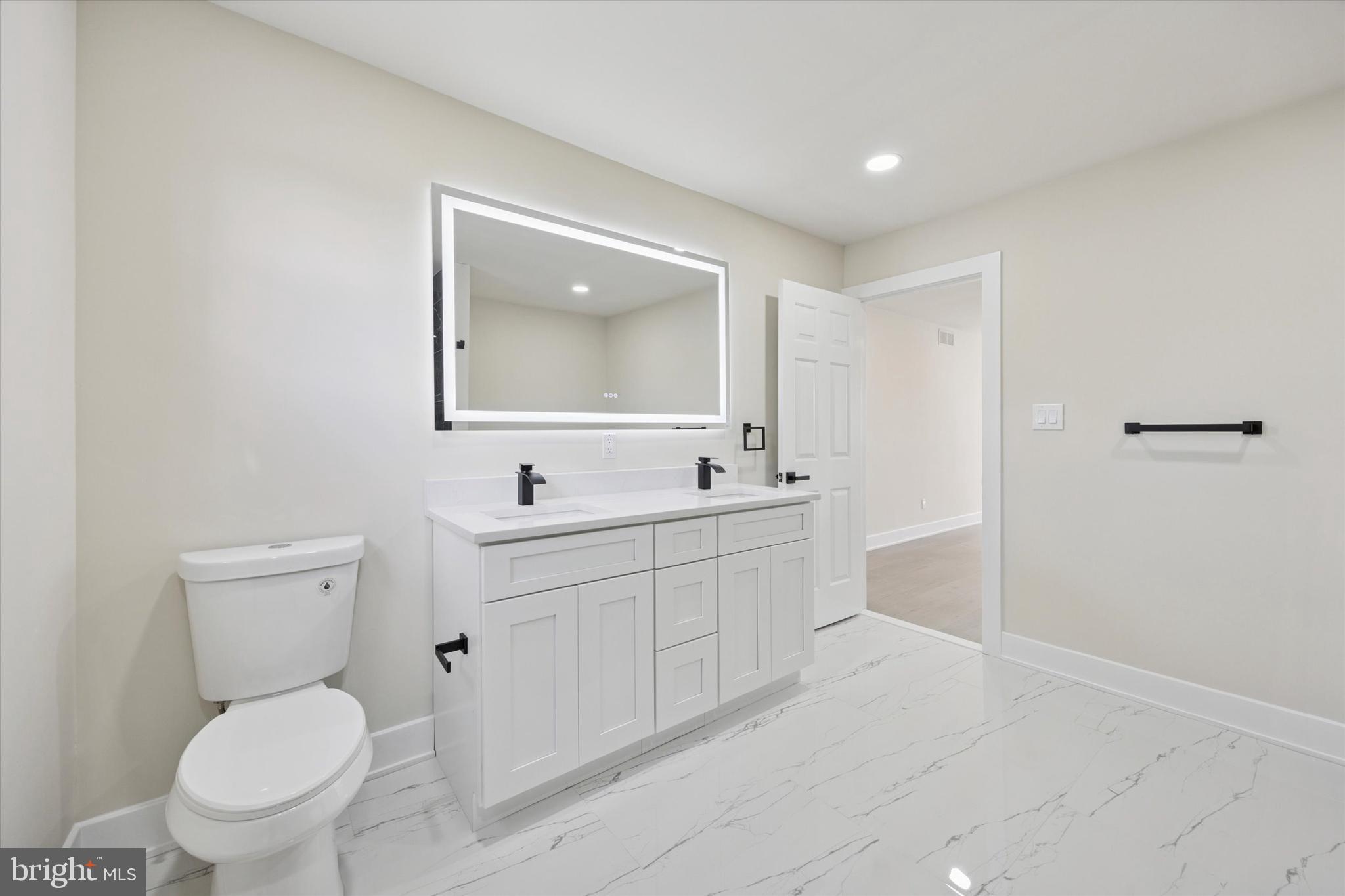 9 Nottingham Road Marlton, NJ 08053 - Photo 32 of 35 a bathroom with a toilet sink and mirror