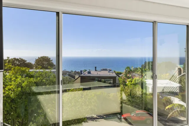 a bathroom with a sink a mirror and a bathtub