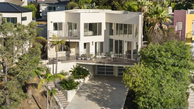 an aerial view of a house with outdoor space