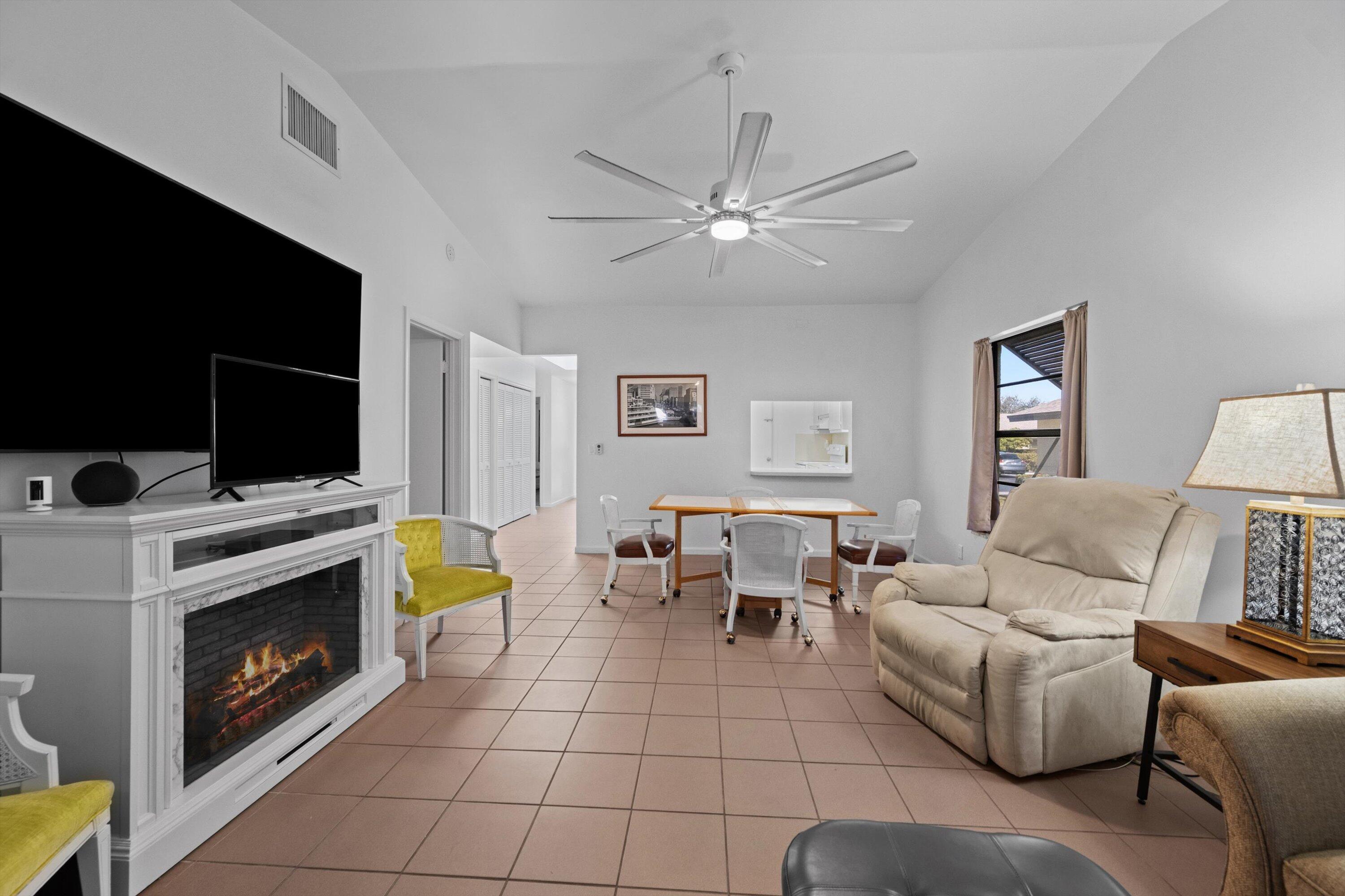 2 Ridge Pointe Drive, Unit A Boynton Beach, FL 33435 - Photo 12 of 24 a living room with furniture and a flat screen tv