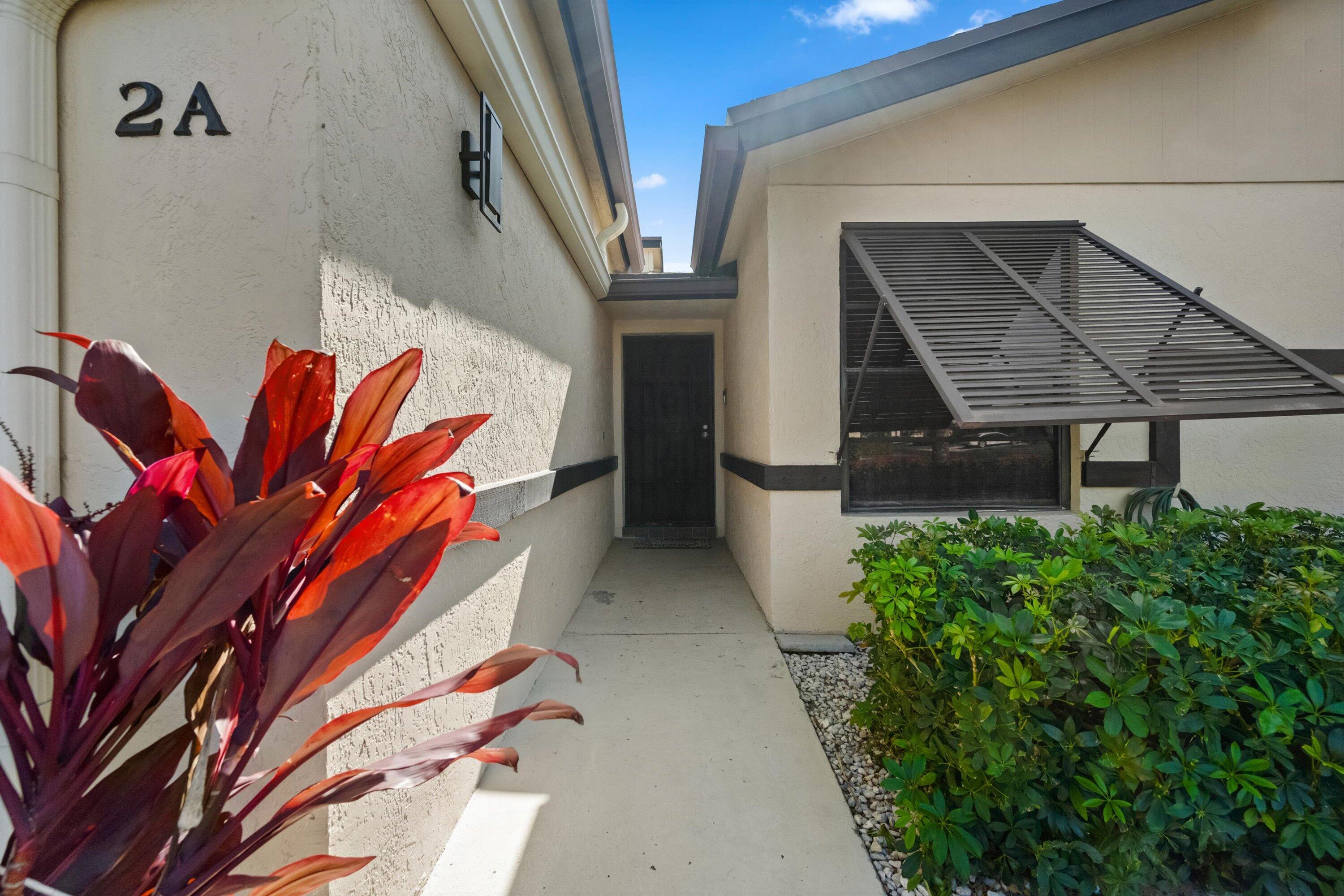 2 Ridge Pointe Drive, Unit A Boynton Beach, FL 33435 - Photo 3 of 24 a view of a door of the house