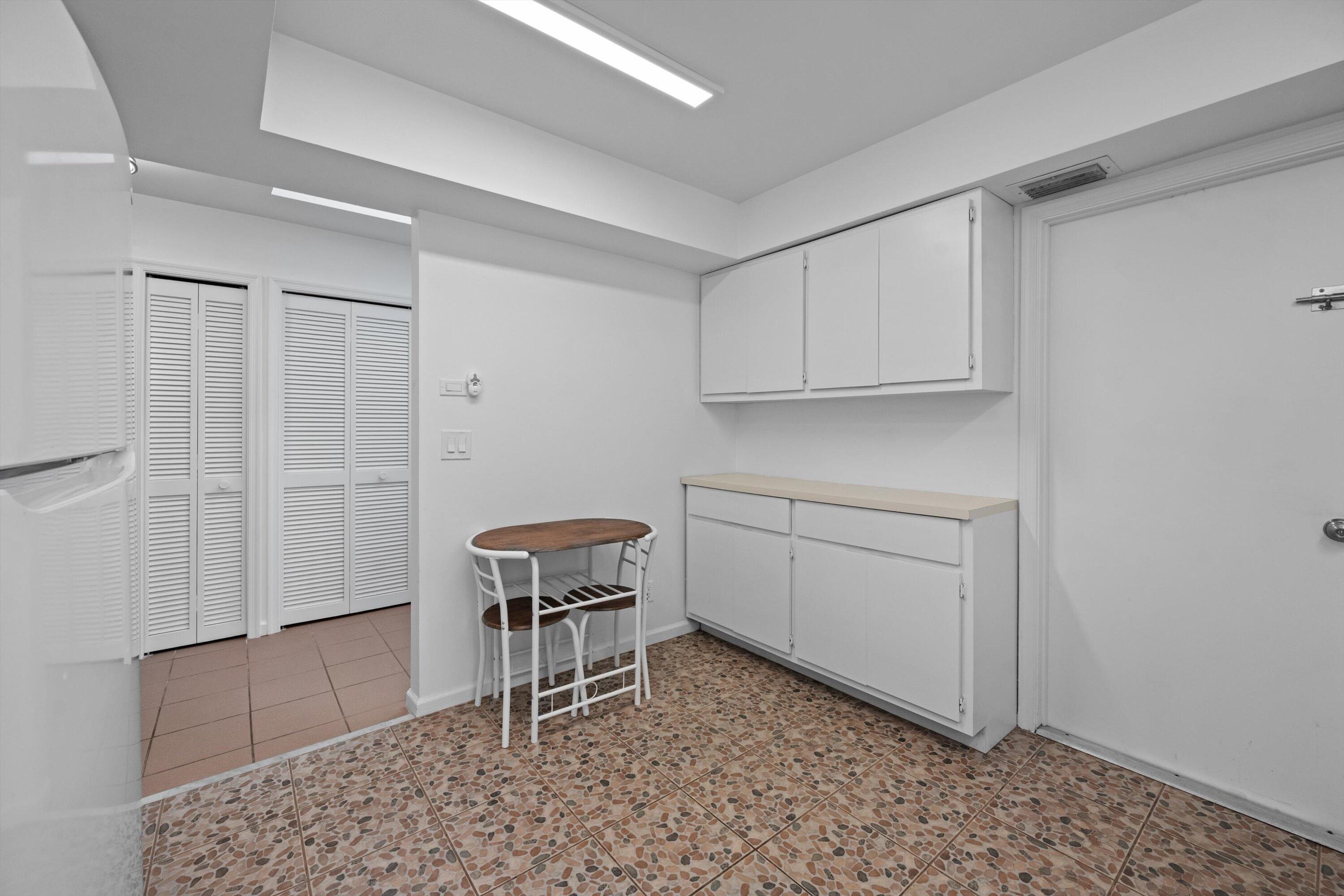 2 Ridge Pointe Drive, Unit A Boynton Beach, FL 33435 - Photo 7 of 24 a room with a table and chairs