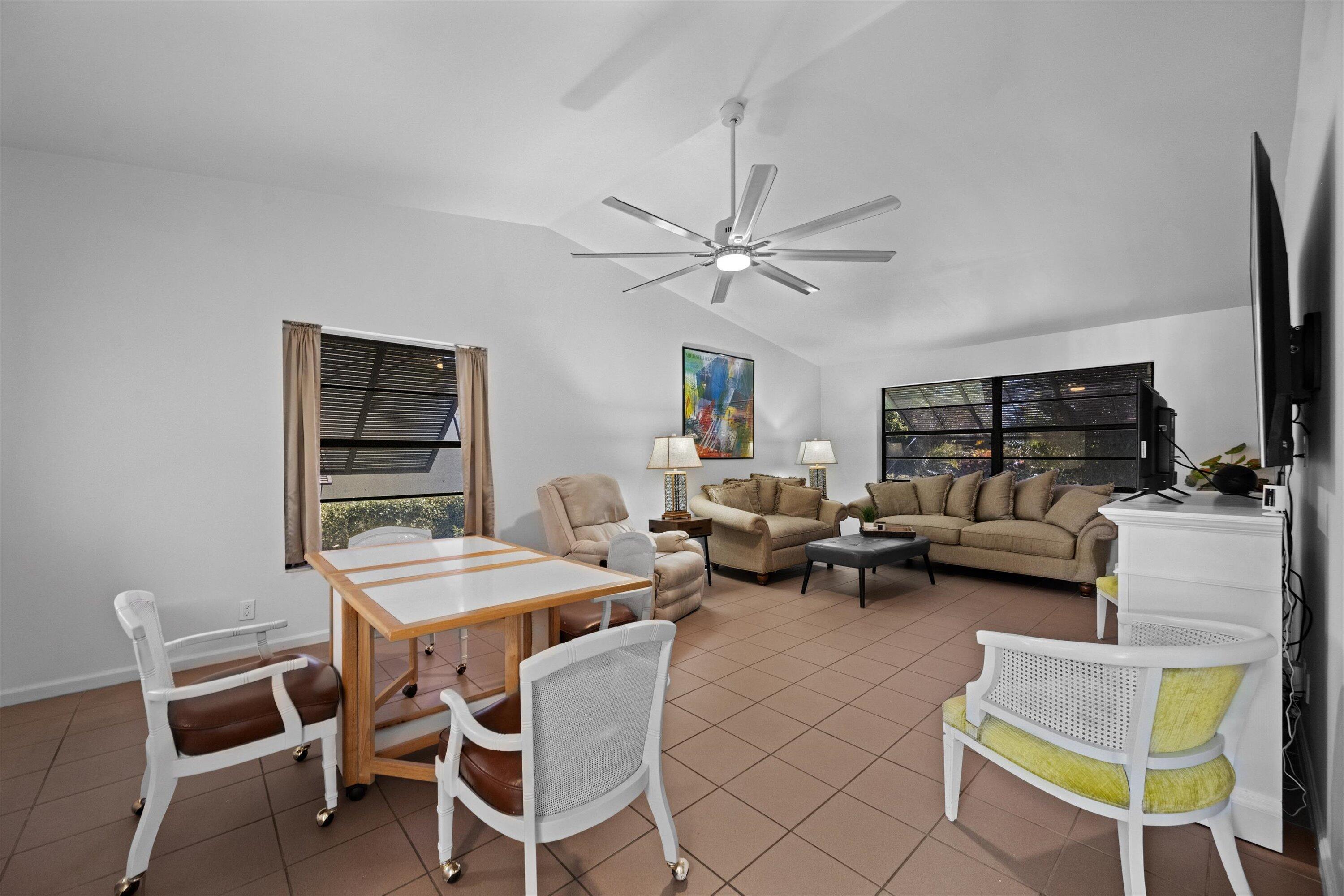 2 Ridge Pointe Drive, Unit A Boynton Beach, FL 33435 - Photo 9 of 24 a view of a livingroom with furniture and a table