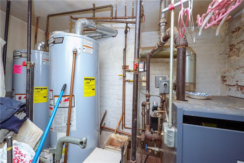 1216 Tabor Court Brooklyn, NY 11219 - Photo 13 of 20 a utility room with dryer and washer