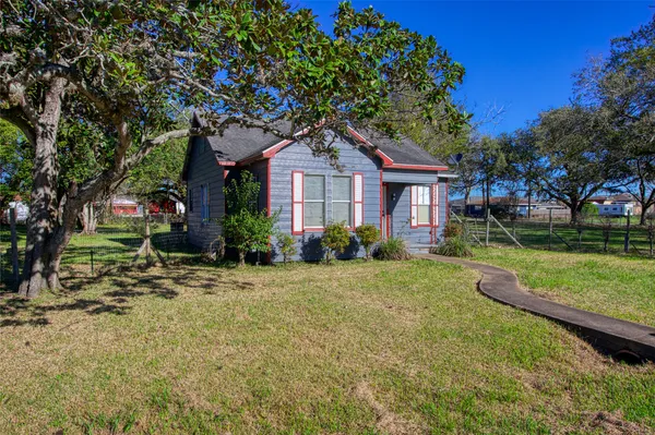 a house with a tree in front of it
