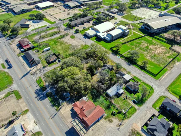 an aerial view of houses with yard