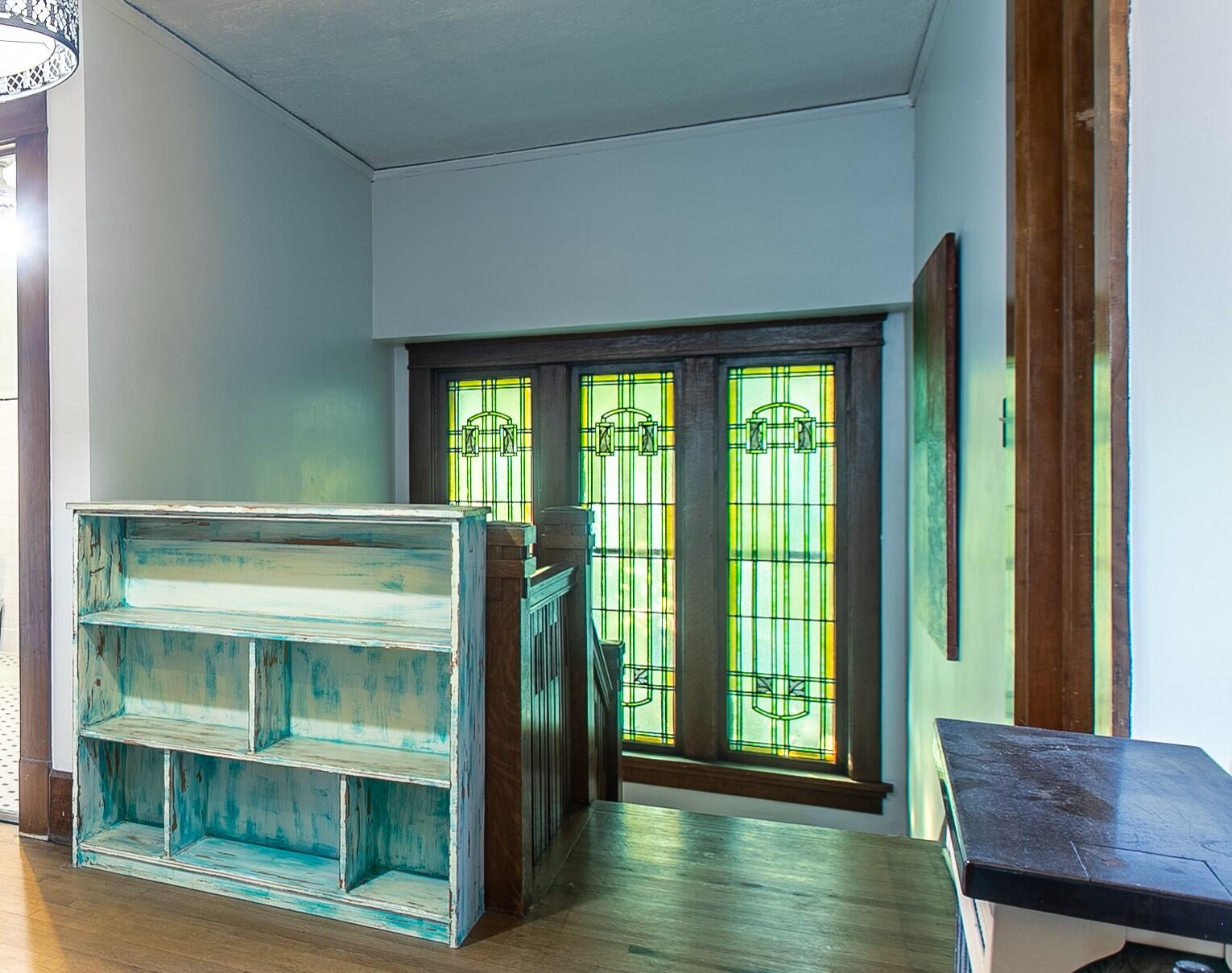 2915 Washington Avenue Racine, WI 53405 - Photo 23 of 29 The home's classic stained glass design carried to the staircase landing!