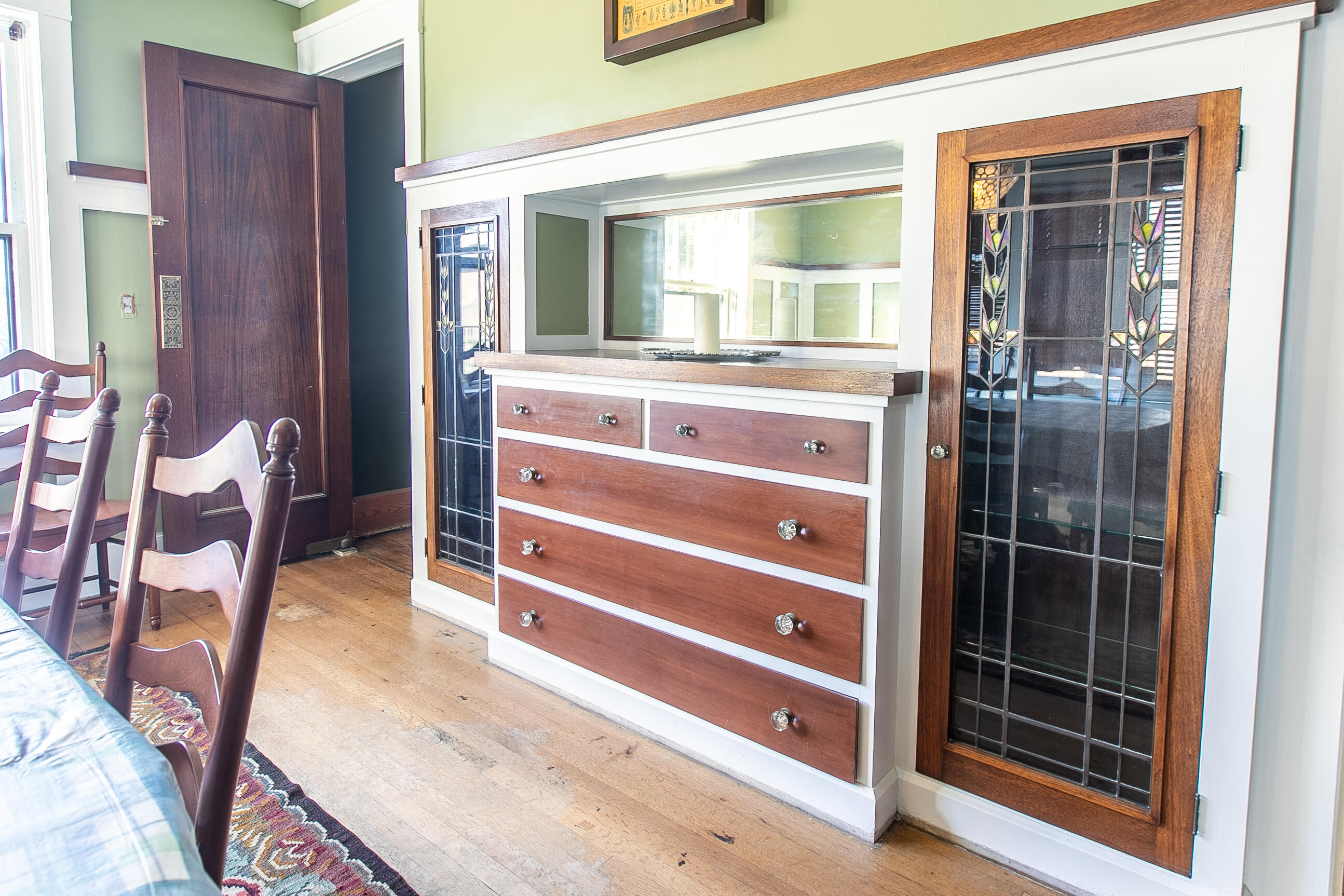 2915 Washington Avenue Racine, WI 53405 - Photo 4 of 29 Original built-in buffet with stained glass doors matching the French doors to the room!